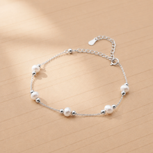 Load image into Gallery viewer, Dainty 18K gold plated freshwater pearl bracelet with minimalist design, ideal for wedding jewelry, by Luxe Treasures.