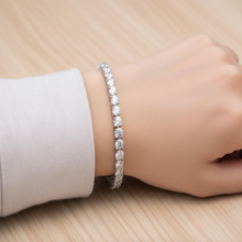 Load image into Gallery viewer, Luxury bridal tennis bracelet by Luxe Treasures featuring sparkling crystal diamonds and a delicate chain design.