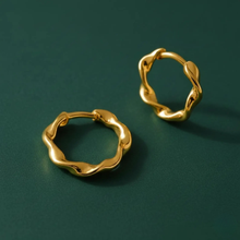 Load image into Gallery viewer, Sterling silver twisted huggie hoop earrings with gold plating, dainty and stylish for everyday wear by Luxe Treasures.