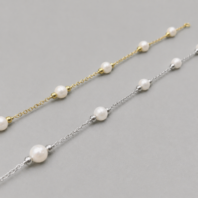 Dainty 18K gold plated freshwater pearl bracelet from Luxe Treasures, minimalist wedding jewelry with a delicate design.
