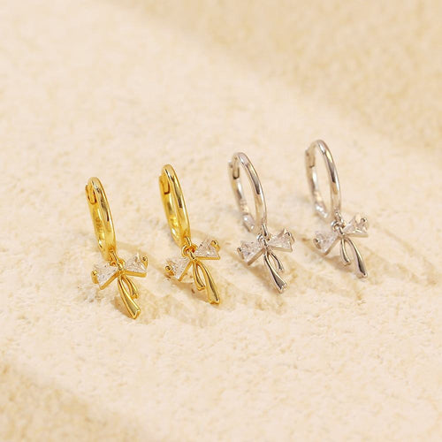 Sterling silver Ribbon Bow Huggie Earrings with dainty bow dangle design, Luxe Treasures jewelry, stylish hoop earrings for women
