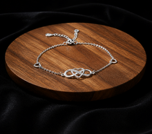 Load image into Gallery viewer, Sterling silver heart bracelet by Luxe Treasures showing a delicate, adjustable minimalist jewelry design on a neutral background.
