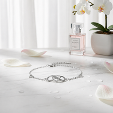 Load image into Gallery viewer, Sterling silver heart bracelet by Luxe Treasures featuring a minimalist, adjustable design on a delicate chain.