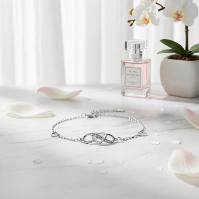 Sterling silver heart bracelet by Luxe Treasures featuring a minimalist, adjustable design on a delicate chain.