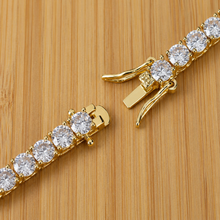Load image into Gallery viewer, Gold tennis bracelet with sparkling zirconia stones from Luxe Treasures, showcasing elegant luxury jewelry design.