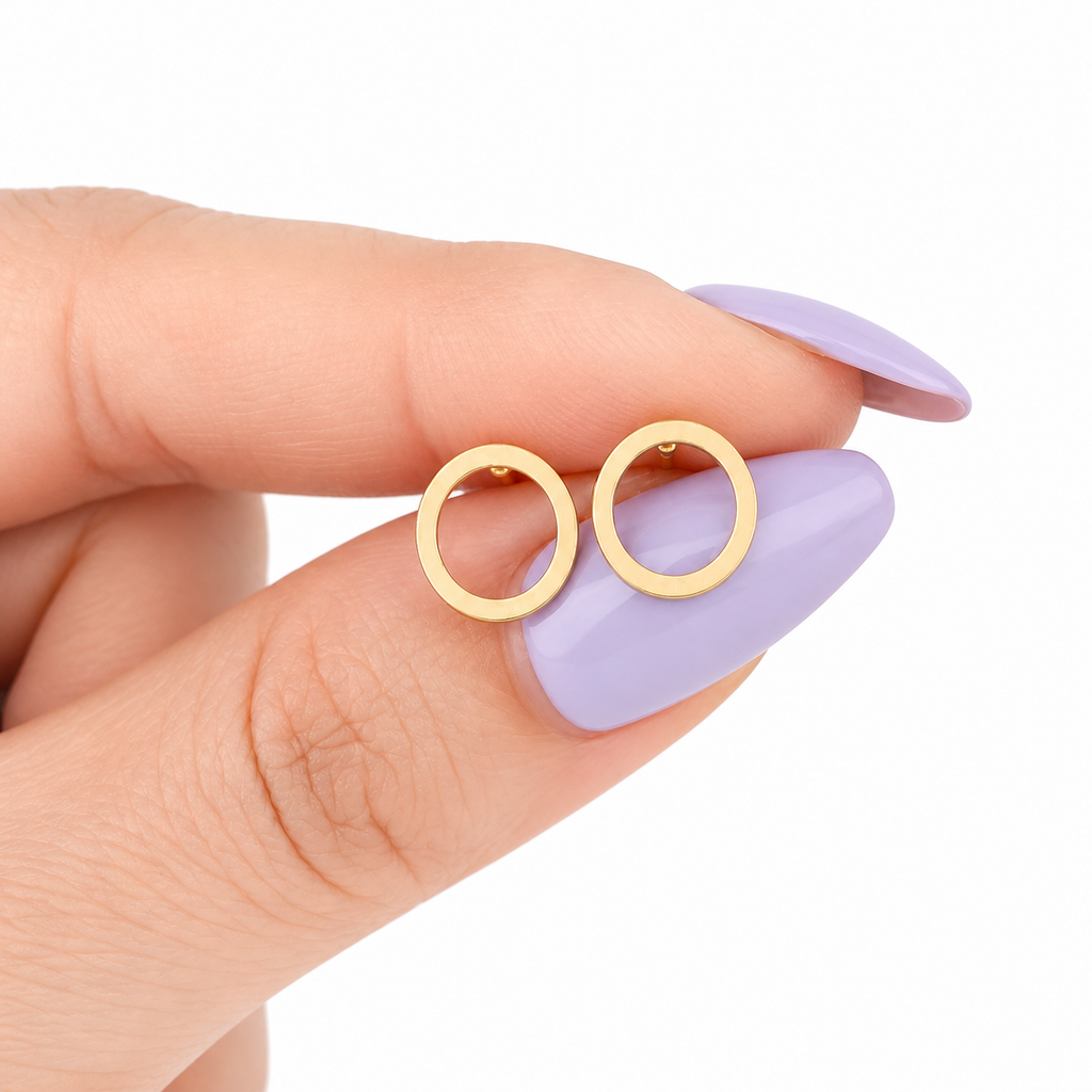 Minimalist open circle stud earrings in gold, silver, and black by Luxe Treasures, displayed on a white background.