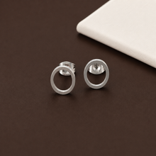 Load image into Gallery viewer, Minimalist open circle stud earrings in gold, silver, and black from Luxe Treasures, showcasing sleek and modern jewelry design.