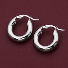 Load image into Gallery viewer, 18K gold plated hoop earrings by Luxe Treasures, thick round hypoallergenic earrings with a polished finish, perfect for everyday wear.