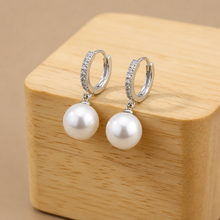 Load image into Gallery viewer, Elegant vintage pearl drop earrings by Luxe Treasures featuring dangling pearl design and intricate metalwork.