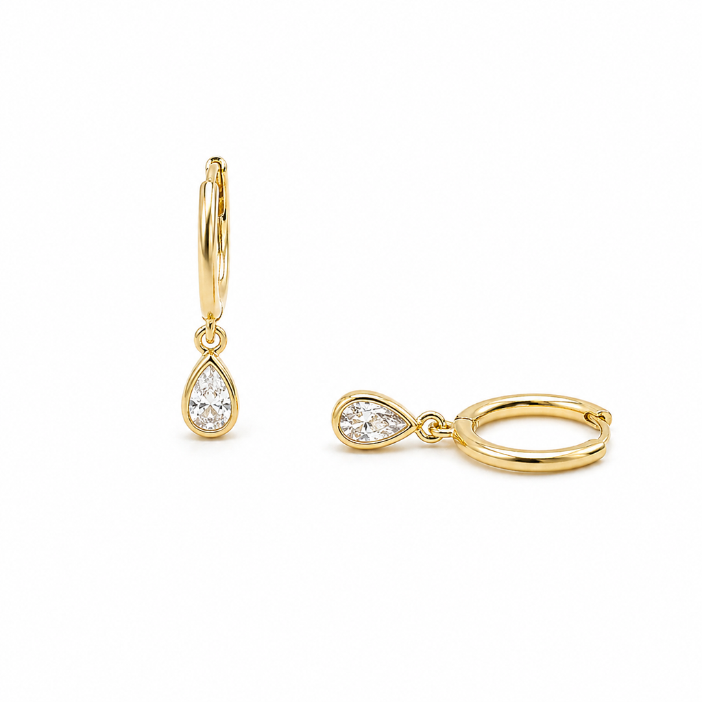 Sterling silver teardrop huggie earrings with dainty cubic zirconia hoops by Luxe Treasures, showcasing elegant jewelry design.