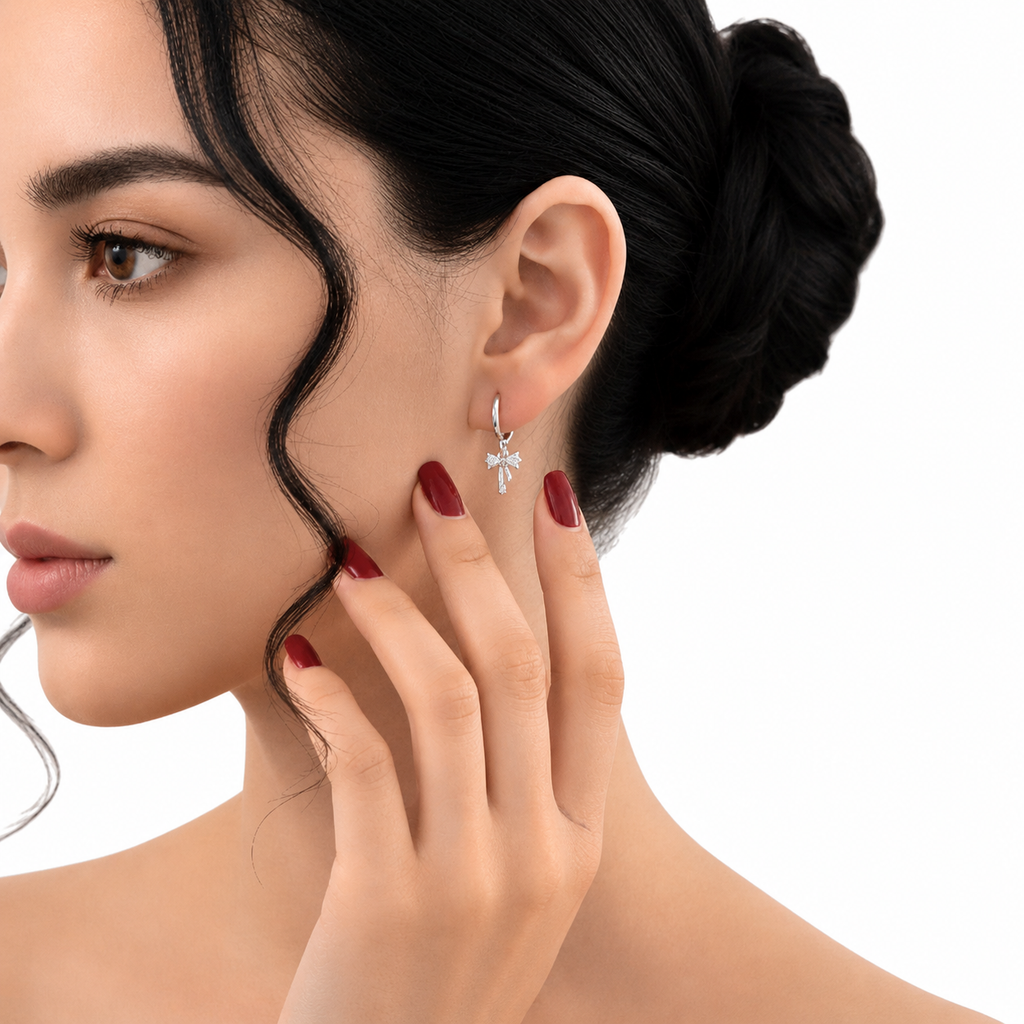 Sterling silver ribbon bow huggie earrings with dainty dangle bows, stylish hoop earrings by Luxe Treasures