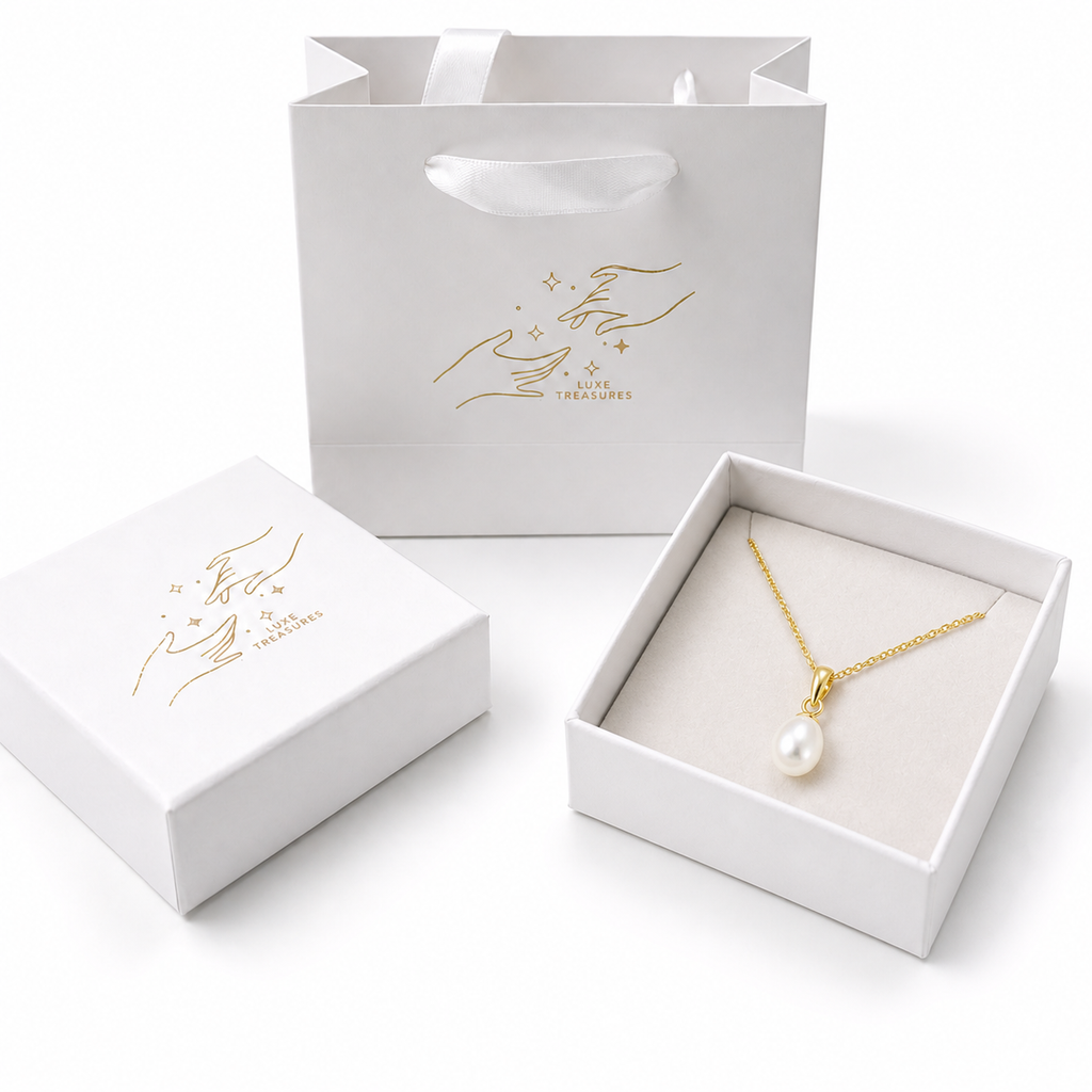 Gold teardrop pearl necklace with freshwater pearl pendant from Luxe Treasures, showcasing elegant jewelry design.