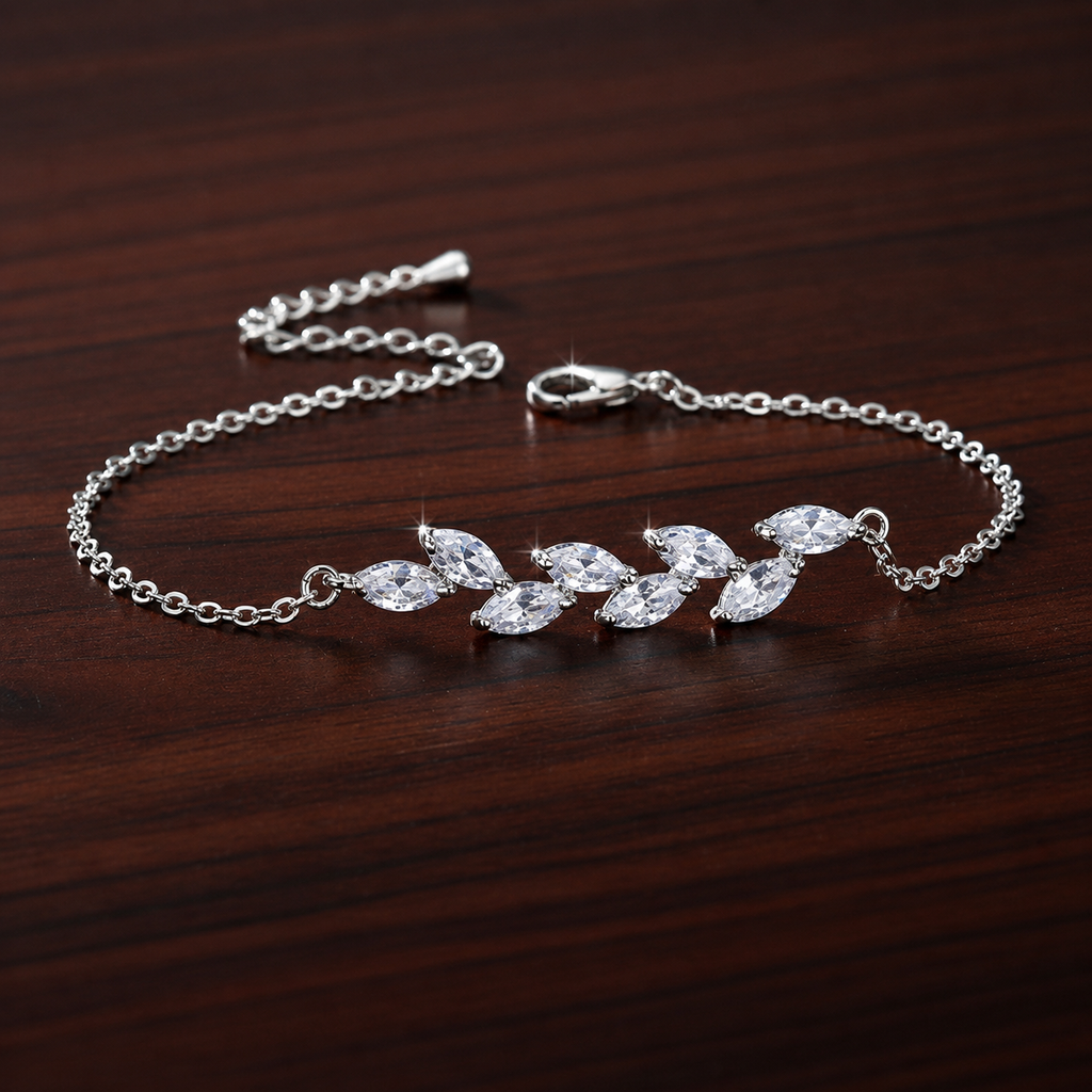 Dainty Leaf Marquise CZ bracelet by Luxe Treasures, minimalist bridal jewelry with leaf-shaped CZ accents on a delicate chain.