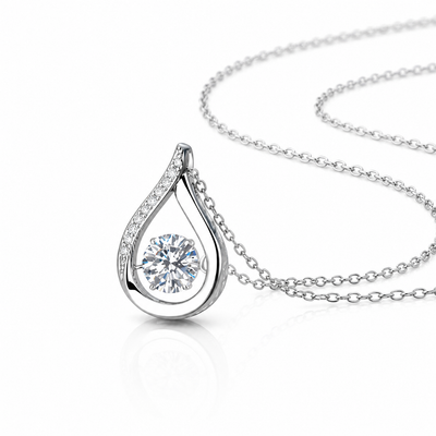 Sterling silver moissanite teardrop necklace with dainty bridal pendant, featuring sparkling stone and elegant design.