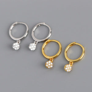 Gold diamond huggie hoop earrings for women, featuring dainty drop dangle design, suitable for minimalist bridal jewelry.