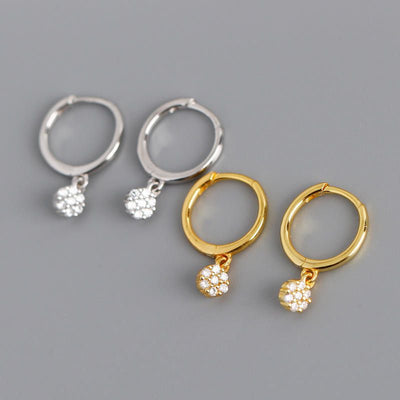 Gold diamond huggie hoop earrings for women, featuring dainty drop dangle design, suitable for minimalist bridal jewelry.