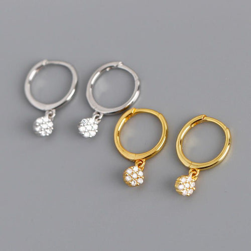Gold diamond huggie hoop earrings for women, featuring dainty drop dangle design, suitable for minimalist bridal jewelry.