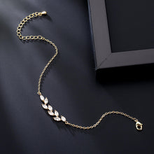 Load image into Gallery viewer, Dainty Leaf Marquise CZ bracelet from Luxe Treasures, minimalist bridal jewelry featuring delicate leaf and marquise-shaped CZ stones.