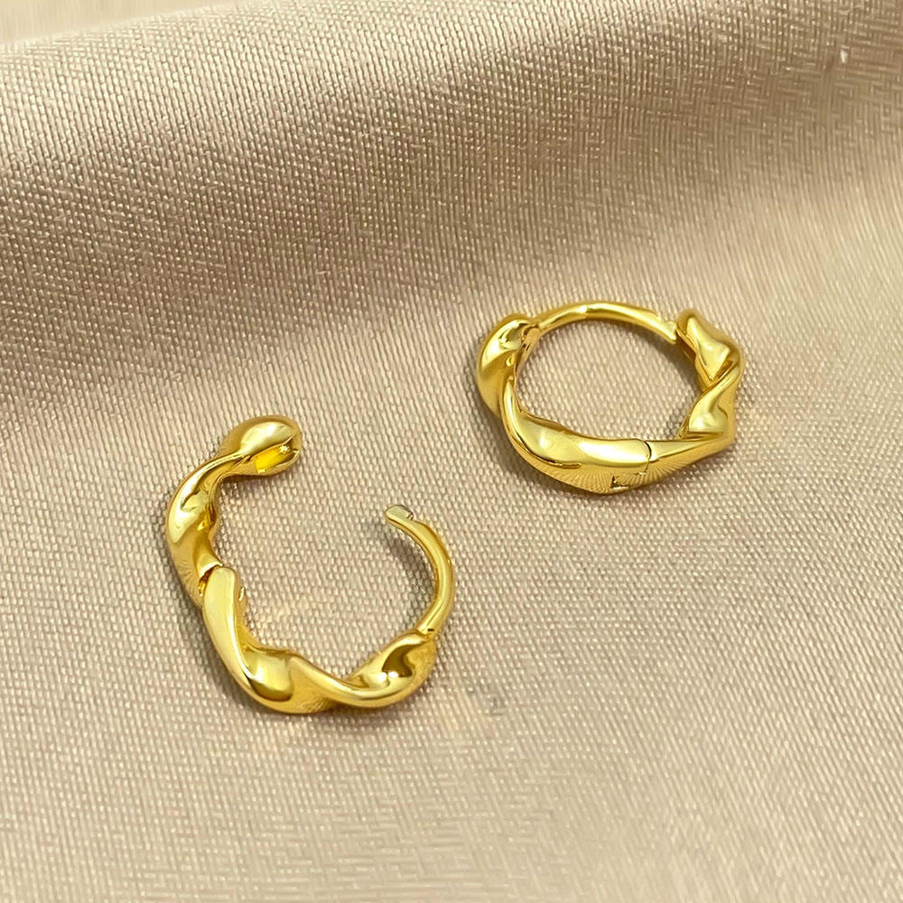 Sterling silver twisted huggie hoop earrings with gold plating, dainty and stylish jewelry by Luxe Treasures.