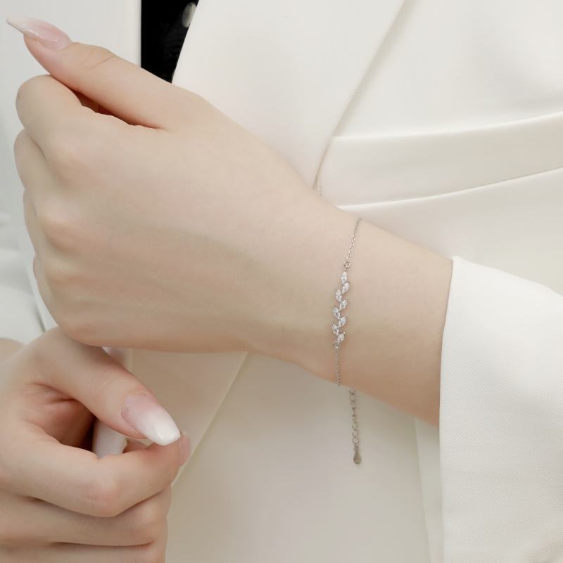 Dainty Leaf Marquise CZ bracelet by Luxe Treasures featuring minimalist bridal jewelry with leaf-shaped marquise stones and delicate design.
