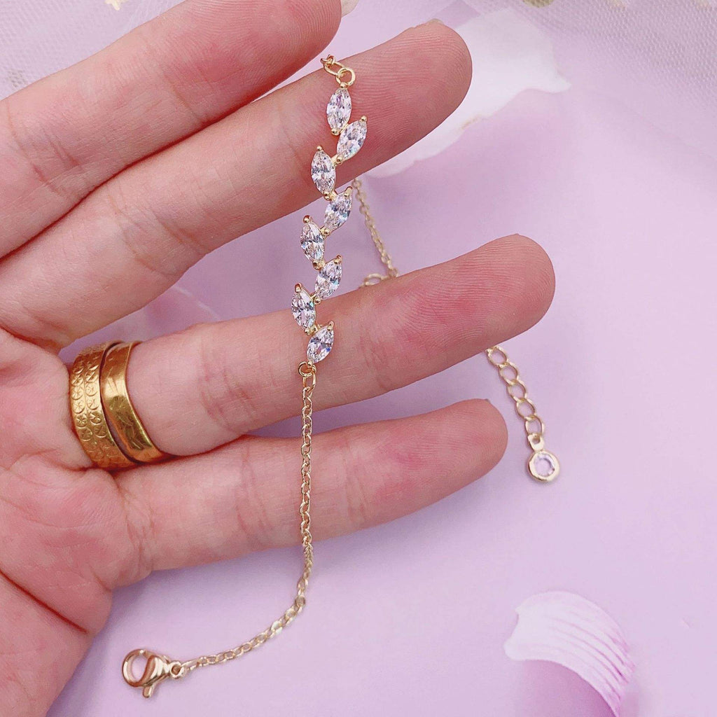 Dainty Leaf Marquise CZ bracelet by Luxe Treasures, minimalist bridal jewelry with leaf-shaped marquise stones on a delicate chain.
