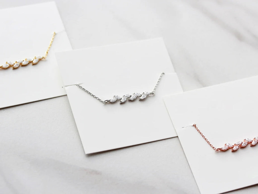 Dainty Leaf Marquise CZ bracelet by Luxe Treasures, minimalist bridal jewelry with delicate leaf-shaped CZ accents on a fine chain.