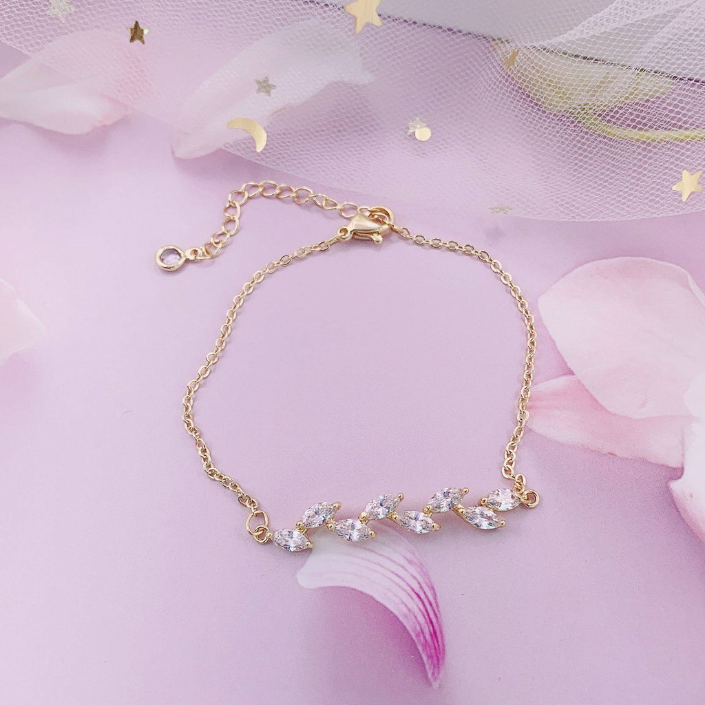 Dainty Leaf Marquise CZ bracelet from Luxe Treasures, minimalist bridal jewelry with delicate leaf-shaped charms and sparkling cubic zirconia.