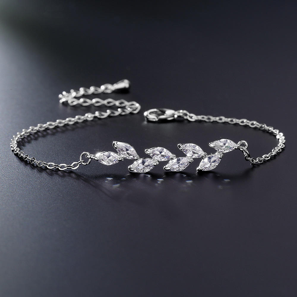 Dainty Leaf Marquise CZ bracelet by Luxe Treasures, minimalist bridal jewelry with sparkling leaf-shaped stones on a delicate chain.