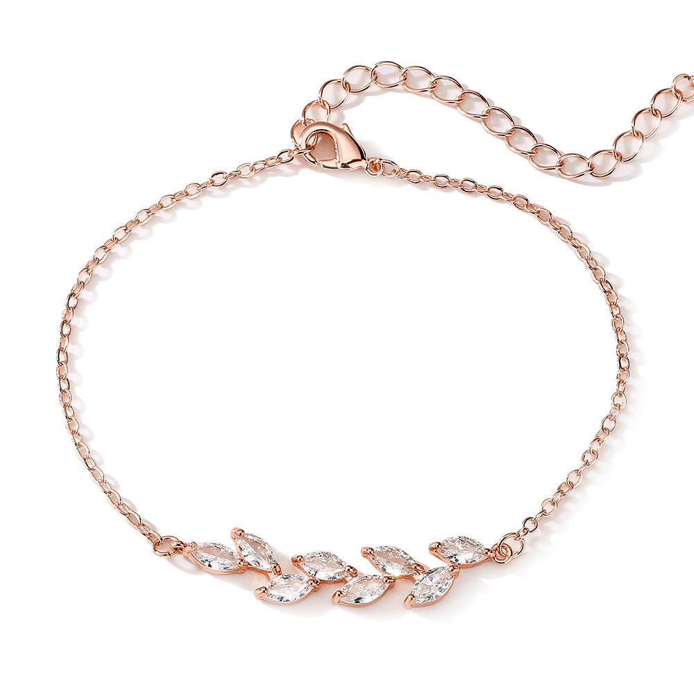 Dainty Leaf Marquise CZ bracelet from Luxe Treasures, minimalist bridal jewelry with leaf-shaped CZ accents on a delicate chain.