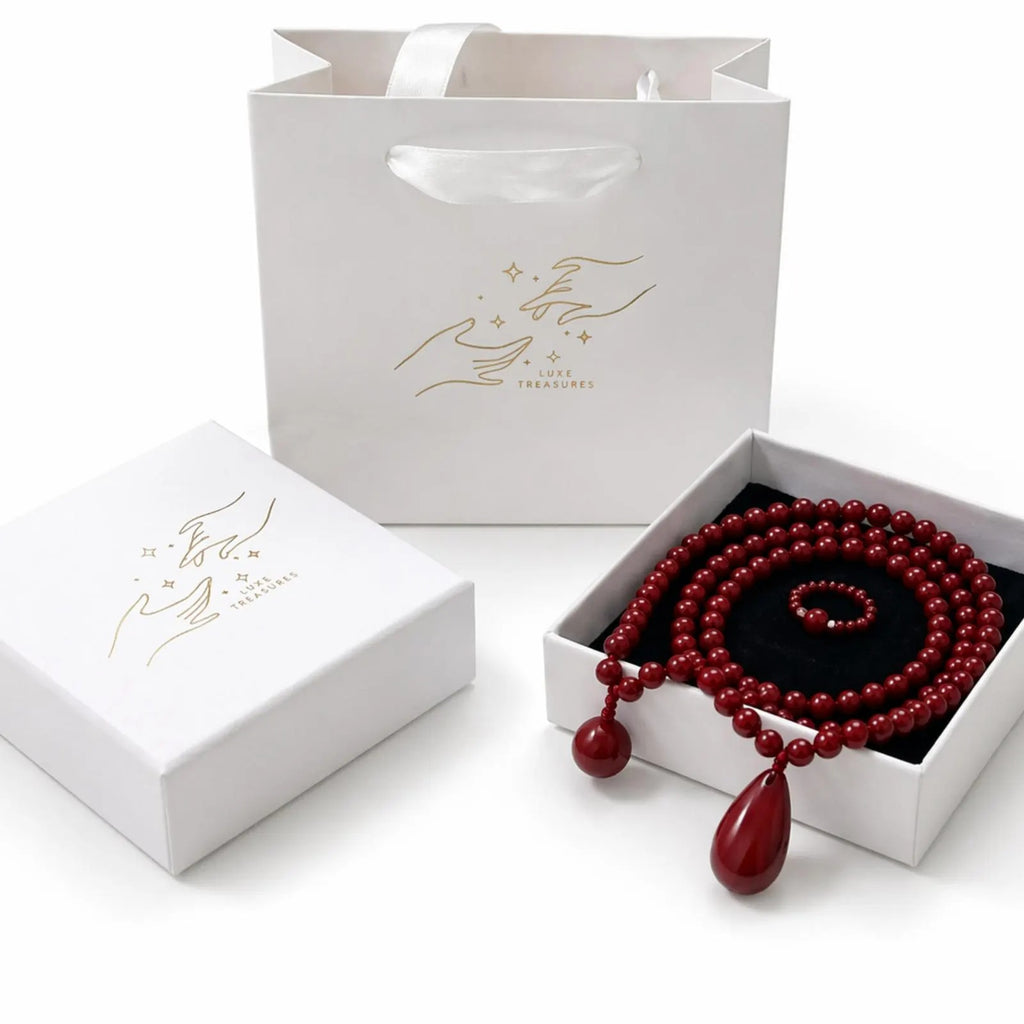 Red beaded teardrop jewelry set including necklace, bracelet, and ring, handcrafted by Luxe Treasures with intricate beadwork.