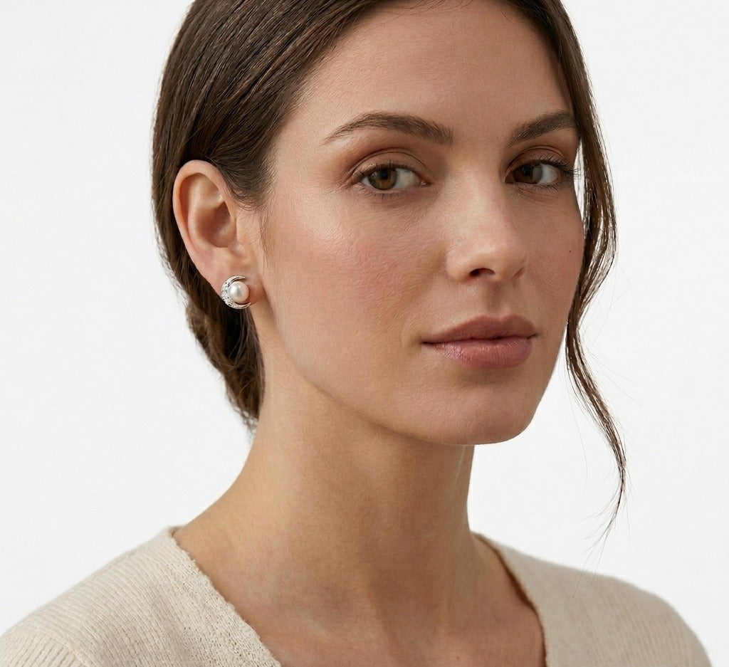 Silver moon stud earrings paired with pearl detail