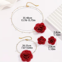 Load image into Gallery viewer, Luxe Treasures floral jewelry set with red, black, and white necklace, bracelet, and earrings in a premium gift box.