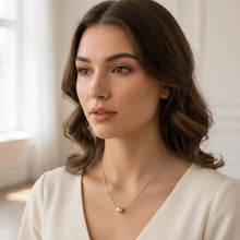 Load image into Gallery viewer, Sterling silver ball necklace with snake bone chain, minimalist boho jewelry style, featuring smooth silver spheres and delicate chain.