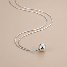 Load image into Gallery viewer, Sterling silver ball necklace on snake bone chain, minimalist boho jewelry with simple, elegant design.