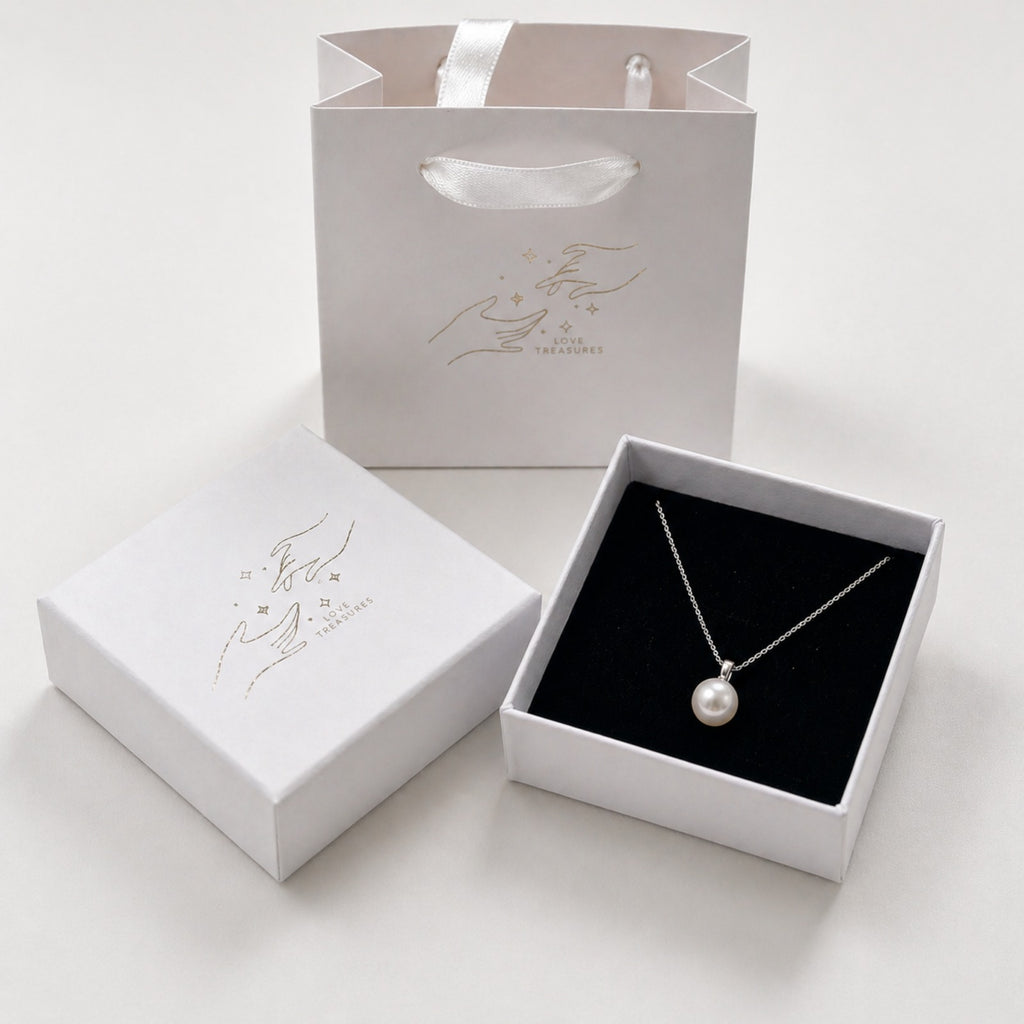 Sterling silver necklace with a fresh water shell pearl pendant, minimalist design by Luxe Treasures.