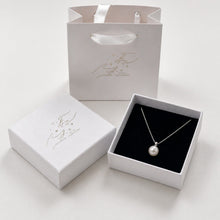 Load image into Gallery viewer, Sterling silver necklace with a fresh water shell pearl pendant, minimalist design by Luxe Treasures.