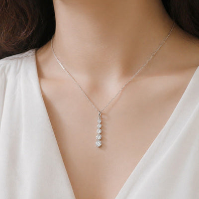 Sterling silver CZ charm necklace with dainty French pendant, elegant jewelry by Luxe Treasures, close-up of the detailed pendant.