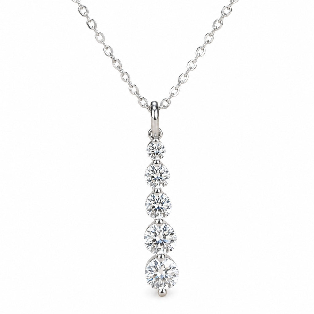 Sterling silver CZ charm necklace with a dainty French pendant, featuring sparkling cubic zirconia stones and intricate design.