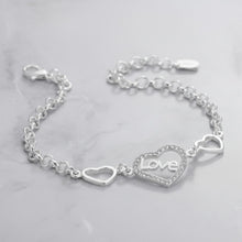 Load image into Gallery viewer, Sterling silver love heart bracelet with geometric chain design by Luxe Treasures, featuring delicate heart and chain links.