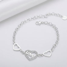 Load image into Gallery viewer, Sterling silver love heart bracelet with geometric chain design, featuring intricate links and a polished finish.