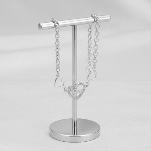 Sterling silver love heart bracelet with geometric chain design, crafted by Luxe Treasures.