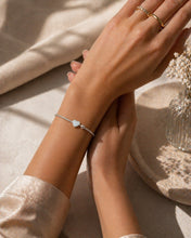 Load image into Gallery viewer, Sterling silver round bead heart bracelet with dainty vintage style, featuring delicate heart charms and smooth silver beads.