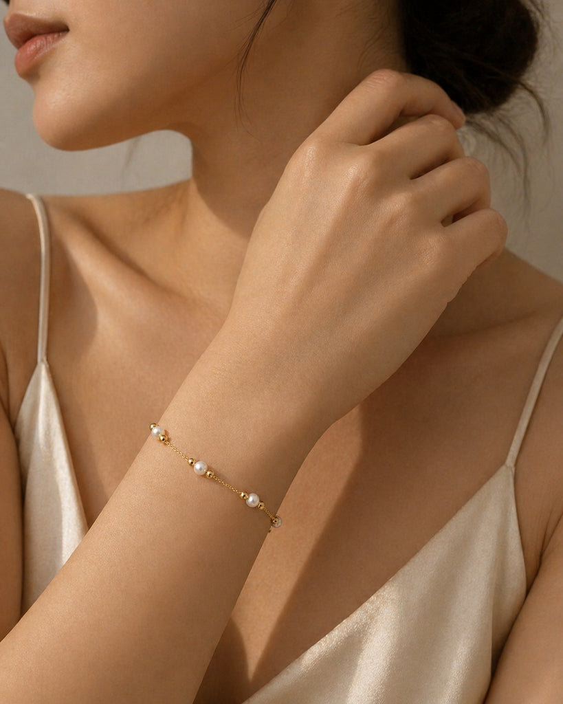 Elegant 18K gold plated freshwater pearl bracelet by Luxe Treasures, featuring delicate minimalist wedding jewelry design.