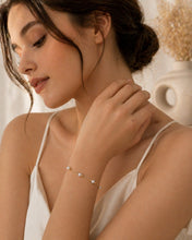 Load image into Gallery viewer, Dainty 18K gold plated freshwater pearl bracelet with minimalist design, perfect for wedding jewelry by Luxe Treasures.
