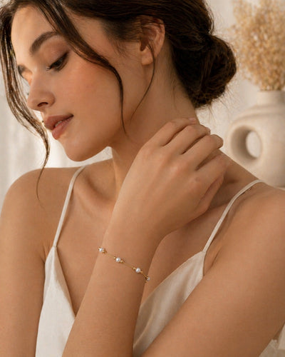 Dainty 18K gold plated freshwater pearl bracelet with minimalist design, perfect for wedding jewelry by Luxe Treasures.