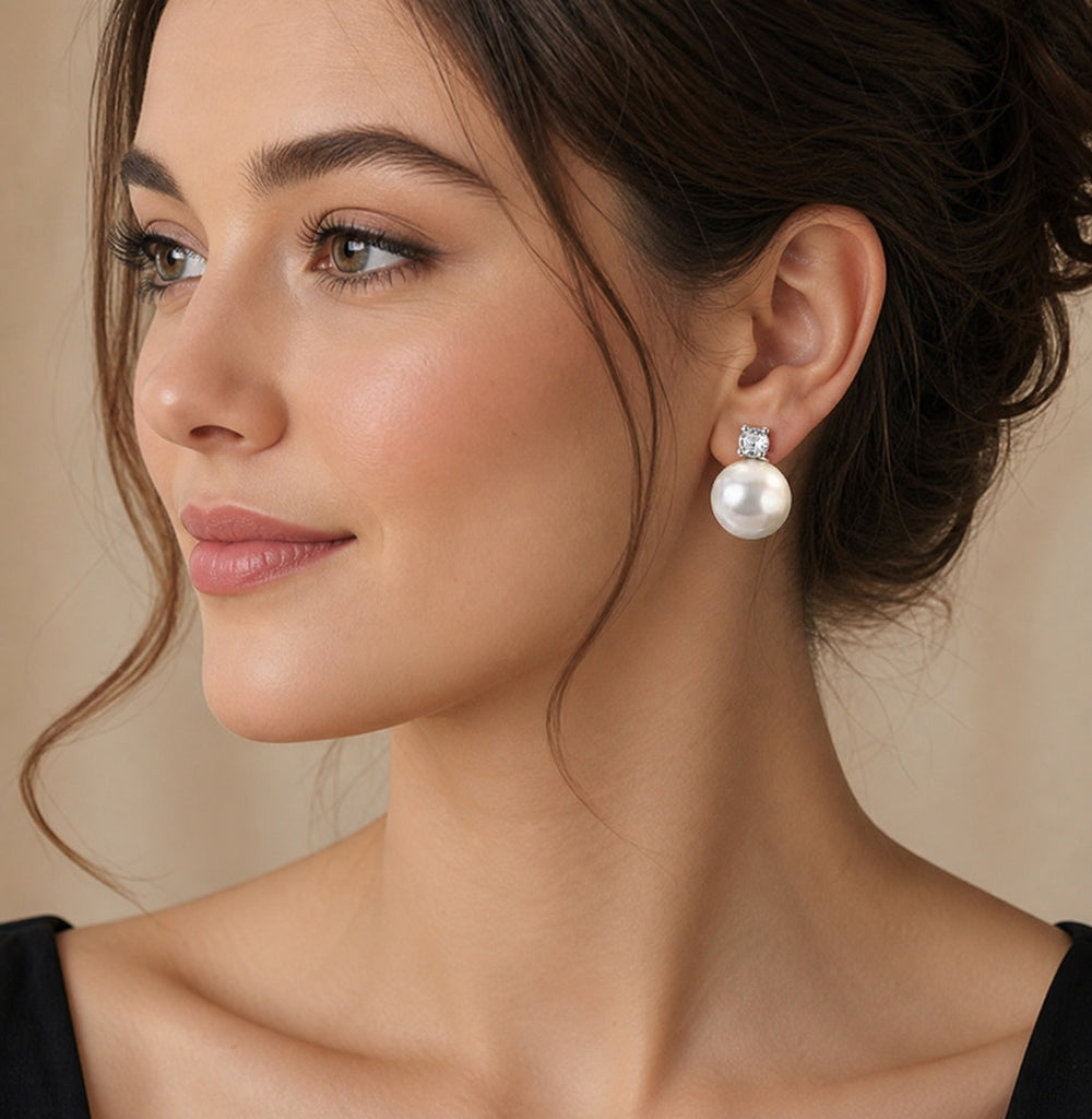 Elegant pearl drop earrings by Luxe Treasures featuring retro-style dangle design with lustrous pearls and vintage-inspired details.