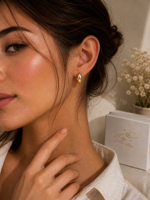 Vintage gold hoop earrings from Luxe Treasures, minimalist round jewelry perfect for everyday wear, displayed on a neutral background.