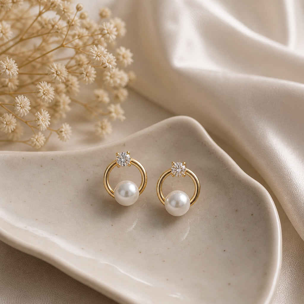 Gold circle dangle earrings with CZ stones and pearls in French style, showcasing elegant jewelry design by Luxe Treasures.