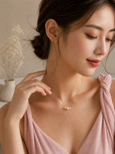 Load image into Gallery viewer, Dainty gold necklace with three freshwater pearls, minimalist layering jewelry by Luxe Treasures, showing close-up of pearls and chain.