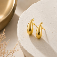 Load image into Gallery viewer, Gold teardrop stud earrings with a minimalist high-polish finish, featuring chunky statement jewelry design from Luxe Treasures.